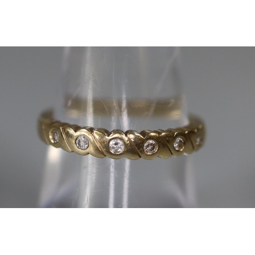 262 - 9ct gold and diamond half eternity ring.  Ring size N&1/2.  Approx weight 2.4 grams.
(B.P. 21% + VAT... 