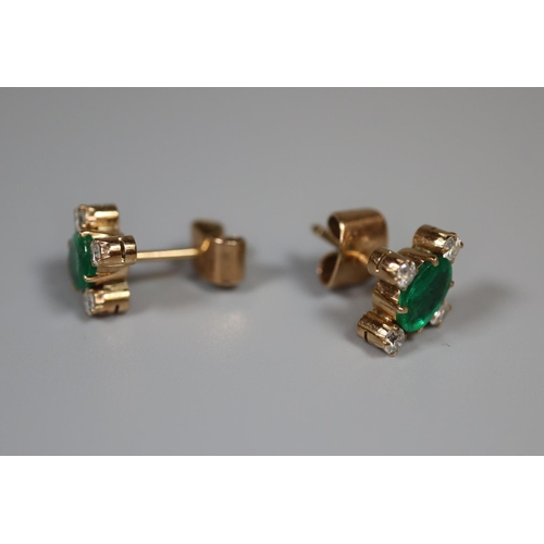 270 - Pair of emerald and diamond earrings set in yellow metal.  Approx weight 2.5 grams.
(B.P. 21% + VAT)