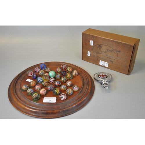 28 - Solitaire wooden and moulded games board comprising a collection of vintage hand made marbles, toget...