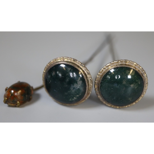 290 - A pair of white metal hat pins set with moss agate together with another hat pin set with agate.
(B.... 