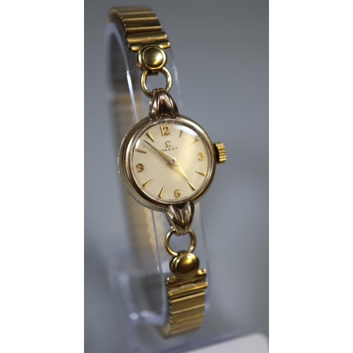 298 - Lady's 9ct Omega wristwatch.  Stamped Omega Watch Co and number 665374 to the inside of the case.  W... 