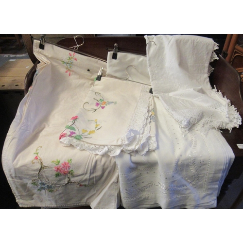 450 - Four good quality vintage linen embroidered tablecloths, two with crochet trim. (4)