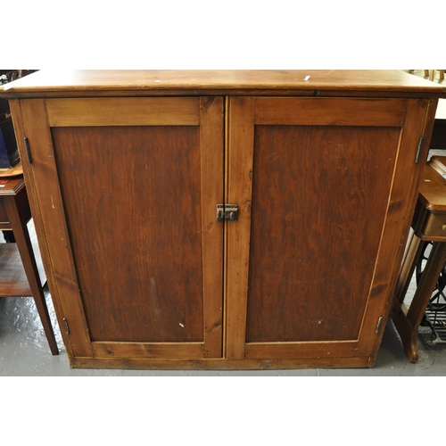 469 - Early 20th century pine farmhouse blind panelled two door press type cupboard, the interior revealin... 