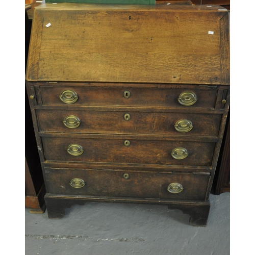 487 - 18th century oak fall front bureau having four long long drawers on a projecting base and bracket fe... 