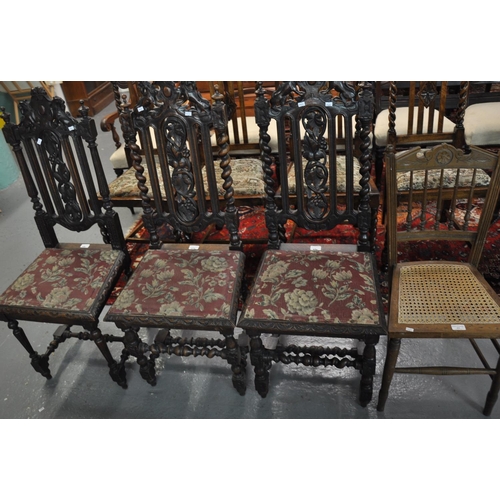 494 - Pair of Victorian stained oak barley twist hall chairs with stylised lion crests, together with anot... 