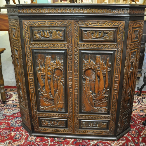 506 - Chinese carved hardwood buffet having hinged lid with carved ornate panels of figures and boats in a... 