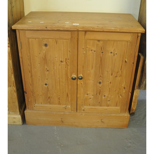 537 - Pine two door blind panelled cupboard, the interior revealing one adjustable shelf on a projecting p... 