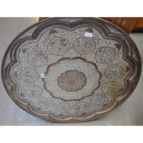 548 - Large Indian copper tray overall with central foliate medallion surrounded by figures in an interior... 