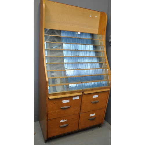 549 - Vintage oak card display stand with four drawers. 
(B.P. 21% + VAT)