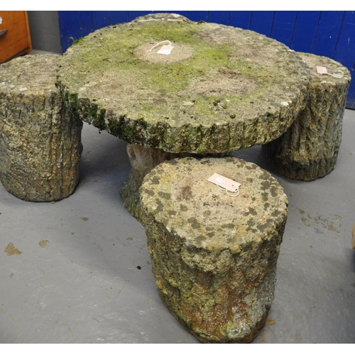 550 - Modern weathered garden table with four matching stools all in the form of tree stumps.  
(B.P. 21% ... 