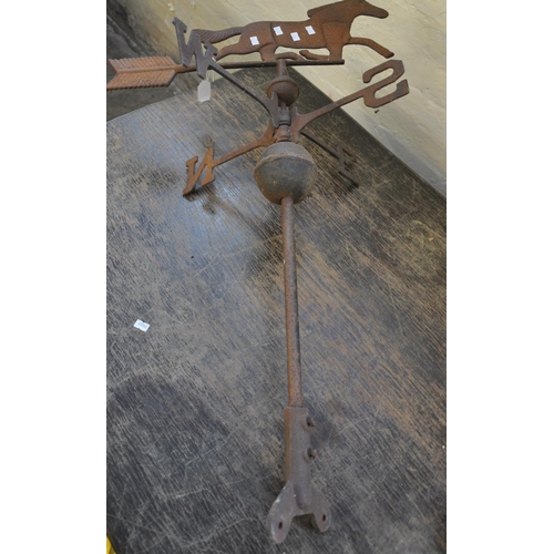 558 - Weathered cast iron weather vane decorated with a horse.  (B.P. 21% + VAT)