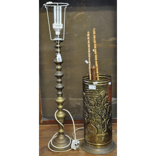 579 - Brass candlestick converted to a table lamp, together with a brass stick stand with assorted items, ... 