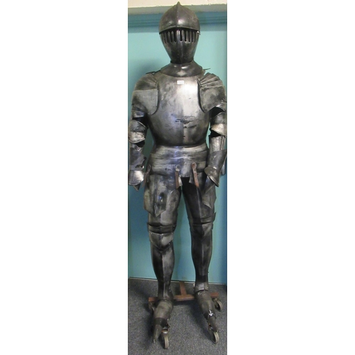 67 - Metal finish theatrical full size model of a knight on metal base with wheels, standing approx 210cm... 