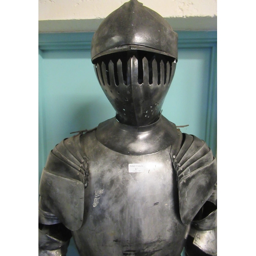 67 - Metal finish theatrical full size model of a knight on metal base with wheels, standing approx 210cm... 