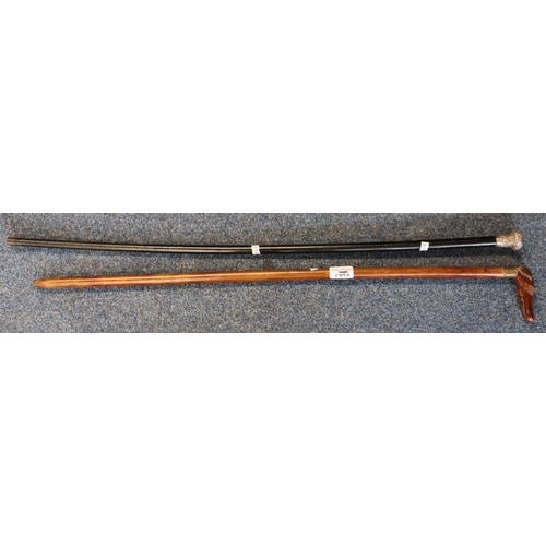 179A - Silver topped ebonised walking cane and another walking cane with carved wooden dog's head handle, h... 