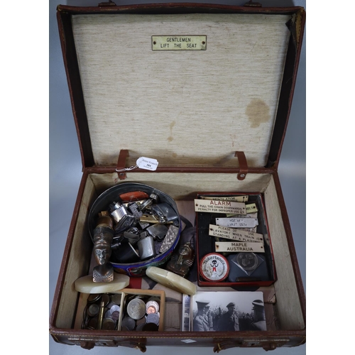 184 - Leather suitcase, to include: vintage GWR wooden carriage warning tags, various lighters, coins, cut... 