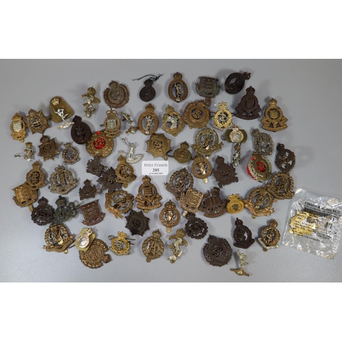 205 - A tub of assorted British military cap badges, various.  Mainly service type regiments.   (B.P. 21% ...