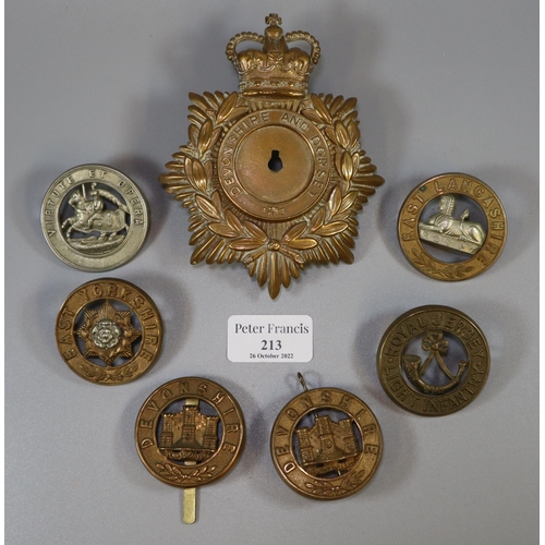 213 - Various military cap badges including East Yorkshire, East Lancashire, Royal Jersey Light Infantry, ... 