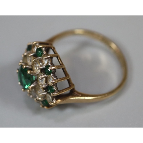 220 - 9ct gold green and white stone cluster ring.  Ring size N.  Approx weight 3 grams.
(B.P. 21% + VAT)