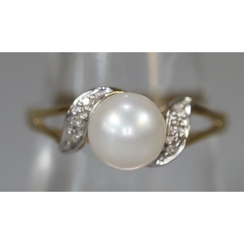 221 - 9ct gold cultured pearl and diamond ring.  Ring size O.  Approx weight 1.9 grams.
(B.P. 21% + VAT)