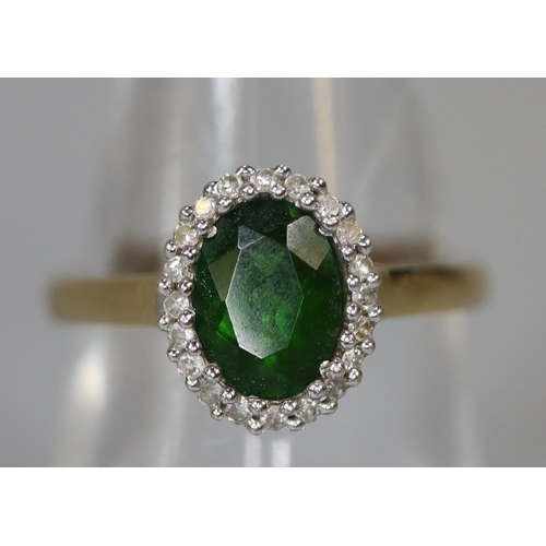 223 - 9ct gold oval green stone and diamond ring.  Ring size O.  Approx weight 2.2 grams.
(B.P. 21% + VAT)