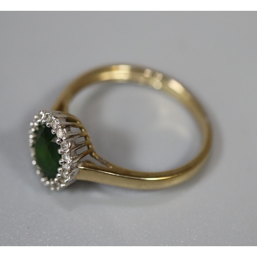 223 - 9ct gold oval green stone and diamond ring.  Ring size O.  Approx weight 2.2 grams.
(B.P. 21% + VAT)