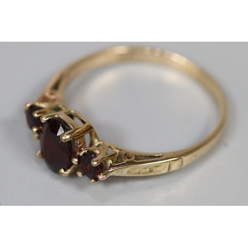 226 - 9ct gold three stone garnet ring.  Ring size P.  Approx weight 1.9 grams.
(B.P. 21% + VAT)