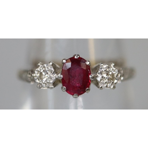 227 - 18ct gold ruby and diamond three stone ring.  Ring size N.  Approx weight 2.1 grams.
(B.P. 21% + VAT... 