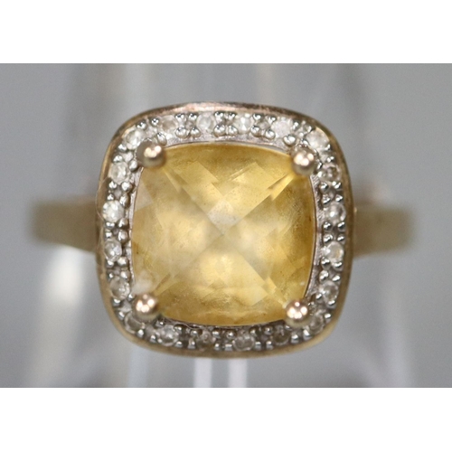 232 - 9ct gold yellow stone and diamond ring.  Ring size O&1/2.  Approx weight 2.9 grams.
(B.P. 21% + VAT)