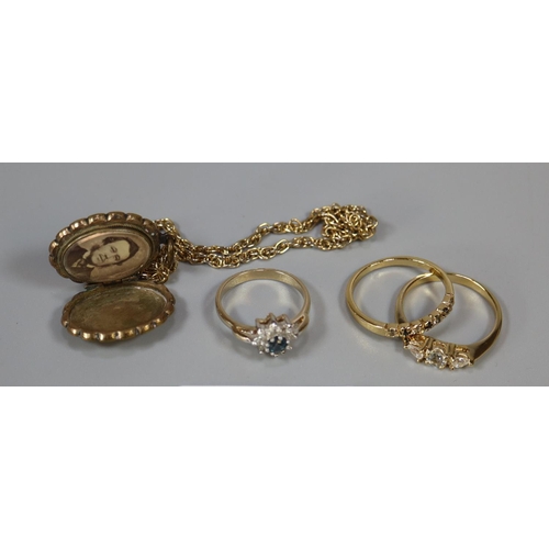 238 - A gold plated locket and three costume rings.
(B.P. 21% + VAT)