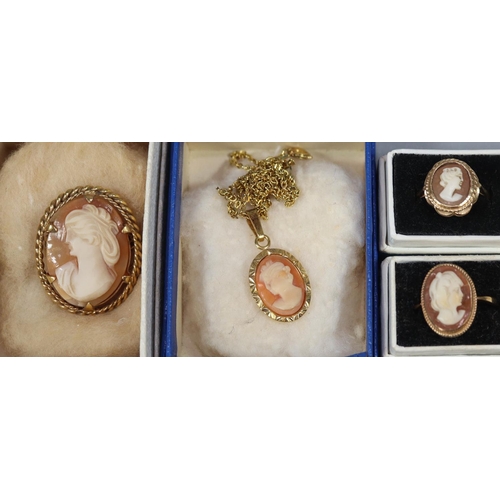 239 - Two 9ct gold shell cameo rings, ring size O and M.  Approx weight 5.3 grams.  Together with a cameo ... 