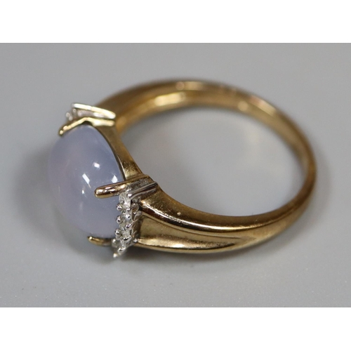 250 - 9ct gold ring set with a cabochon stone with diamond shoulders.  Ring size O.  Approx weight 3.3 gra... 