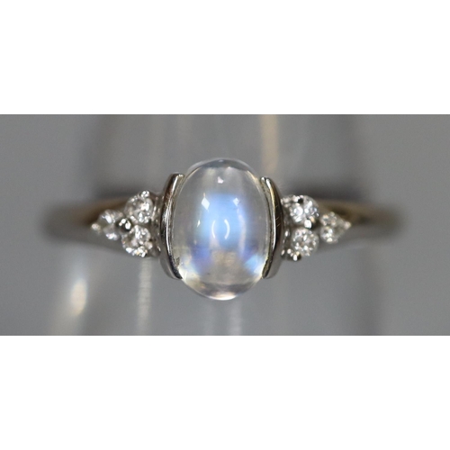 251 - 9ct white gold ring set with a moonstone and diamonds.  Ring size O & 1/2.  Approx weight 2.2 grams.... 