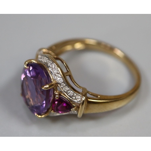 252 - 9ct gold ring set with purple stones and diamonds.  Ring size N.  Approx weight 3.4 grams.
(B.P. 21%... 