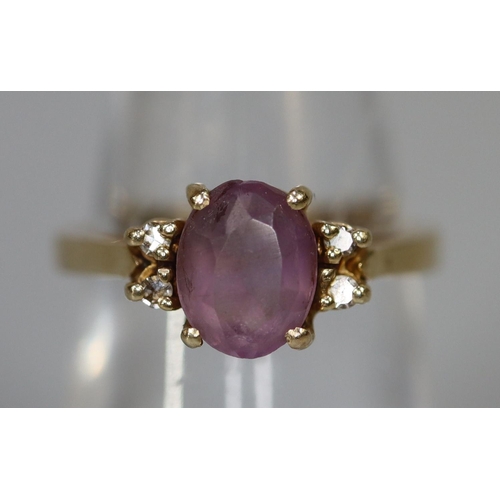 253 - 9ct gold purpe stone ring set with diamonds.  Ring size M & 1/2.  Approx weight 3.2 grams.
(B.P. 21%... 