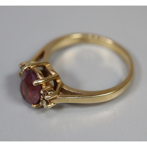 253 - 9ct gold purpe stone ring set with diamonds.  Ring size M & 1/2.  Approx weight 3.2 grams.
(B.P. 21%... 