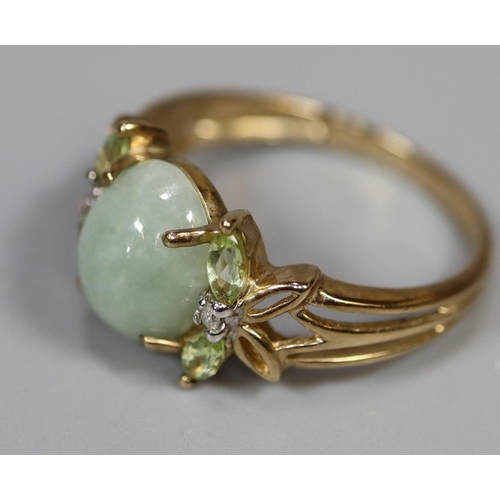 259 - 9ct gold ring set with green hardstone dress ring with foliate shoulders set with diamond chips.  Ri... 