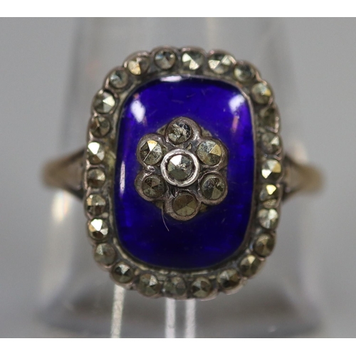 260 - Blue enamel and marcasite ring set in silver with a 9ct gold band.  Ring size O & 1/2.
(B.P. 21% + V... 