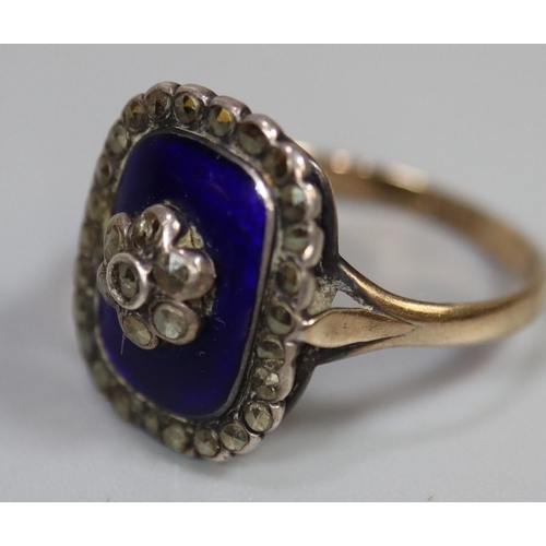 260 - Blue enamel and marcasite ring set in silver with a 9ct gold band.  Ring size O & 1/2.
(B.P. 21% + V... 