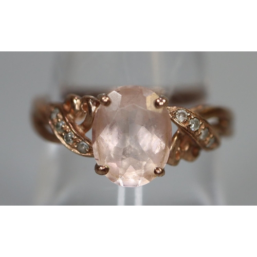 261 - 9ct rose gold ring set with pink stones and diamonds.  Ring size O.  Approx weight 2.5 grams.
(B.P. ... 