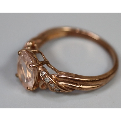 261 - 9ct rose gold ring set with pink stones and diamonds.  Ring size O.  Approx weight 2.5 grams.
(B.P. ... 