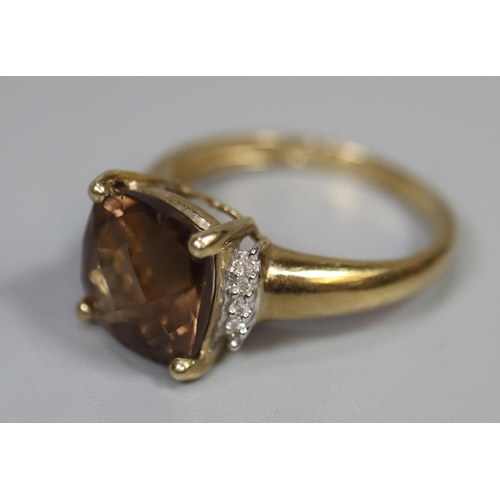 264 - 9ct gold dress ring set with a brown stone and diamonds.  Ring size P.  Approx weight 3.1 grams.
(B.... 