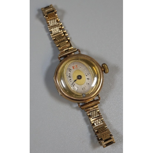 294 - 9ct gold ladies wristwatch with unusual oval dial on 9ct gold bracelet.  20g in total approx.  (B.P.... 