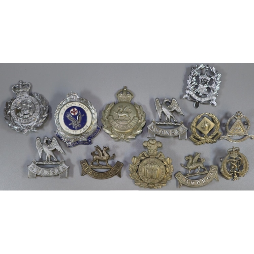 311 - Bag of mainly police cap and other badges, one enamelled, named 'New South Wales Police Force', Sout... 