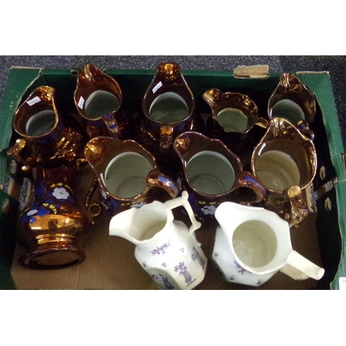 357 - Box of assorted dresser jugs to include: copper lustre and two cream jugs with raised Grecian figure... 