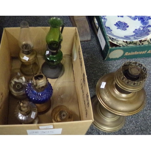 374 - Box of oil lamps and lamp bases including: brass with clear chimney, miniature ones with pressed and... 