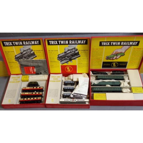 391 - Three OO gauge Trix Twin Railway train sets, all in original boxes with manuals, some original packa... 