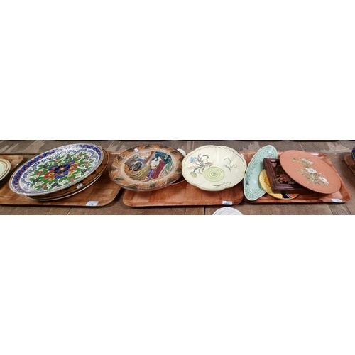 396 - Three trays of ceramics, to include: Art Deco circular floral wall plaque, Majolica floral framed ti... 