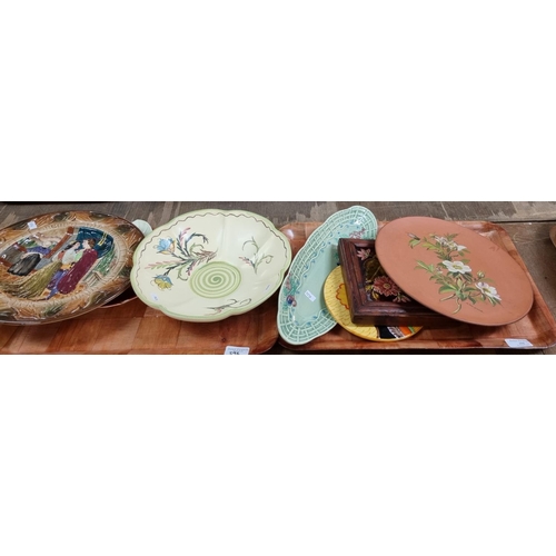 396 - Three trays of ceramics, to include: Art Deco circular floral wall plaque, Majolica floral framed ti... 