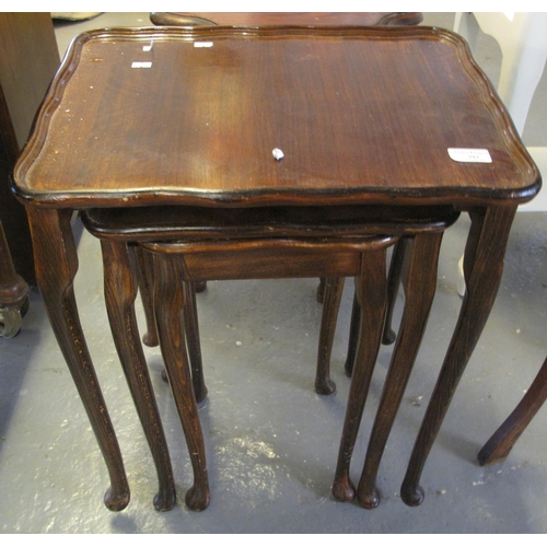 512 - Mahogany nest of three tables on pad feet. 
(B.P. 21% + VAT)